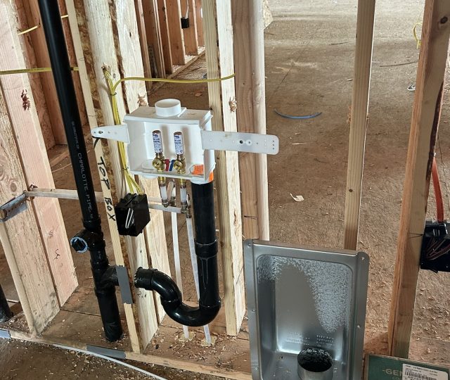 Plumbing rough in on custom home in framing
