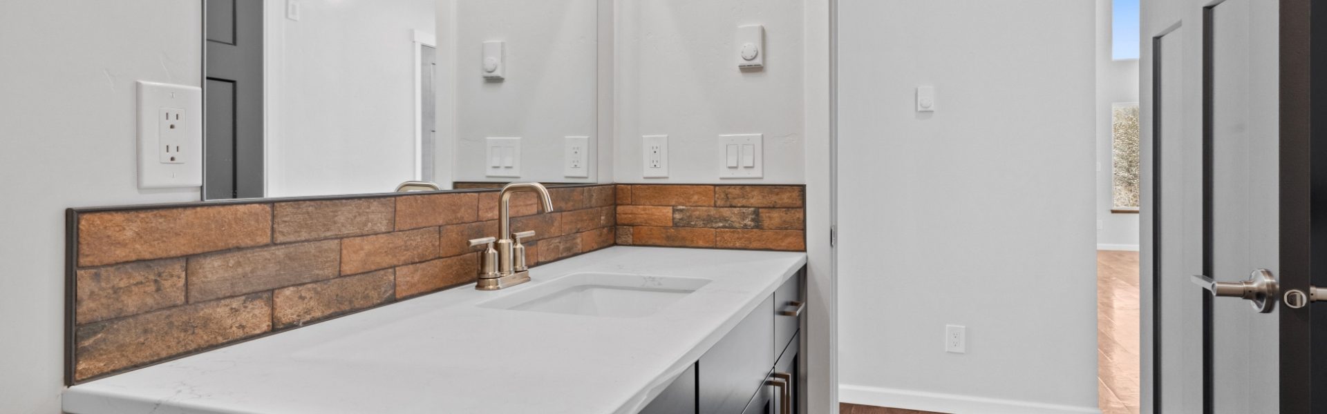 Secondary bath with brick style backsplash